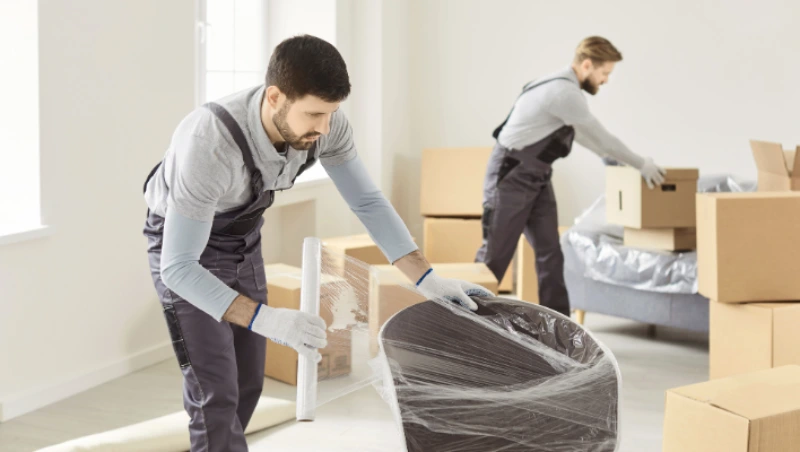 Experienced Villa Movers in Dubai are preparing protective wrapping materials and packing supplies